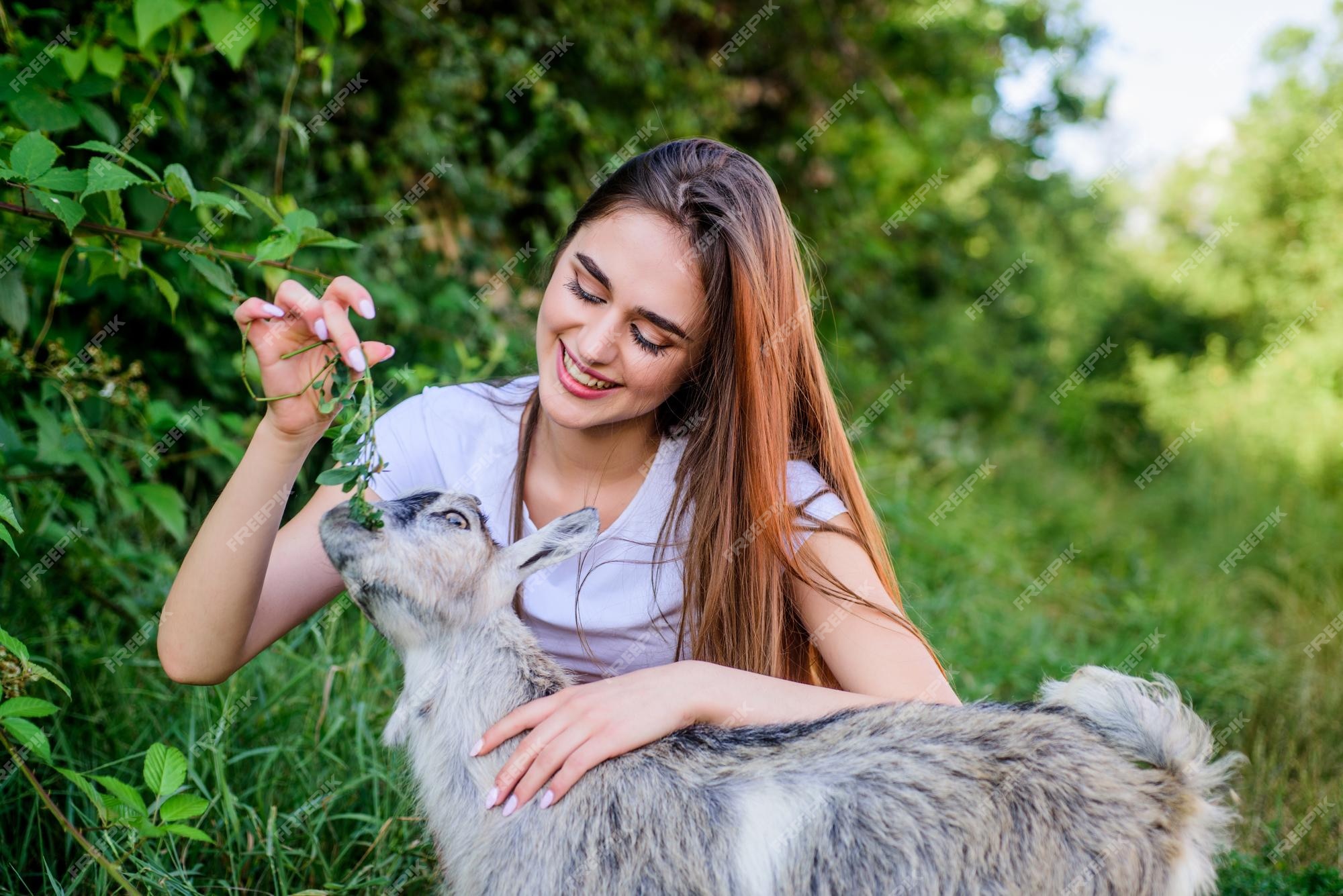 Premium Photo | Woman and small goat green grass veterinarian occupation eco farm love and care animals law farm and farming concept village animals girl play cute goat feeding animal protect animals Premium Photo | Woman and small goat green grass veterinarian occupation eco farm love and care animals law farm and farming concept village animals girl play cute goat feeding animal protect animals