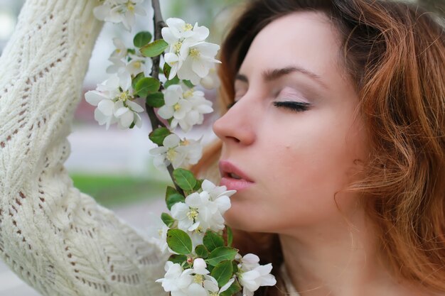 Woman smell tree flower