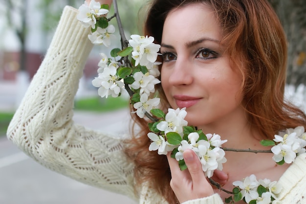 Woman smell tree flower