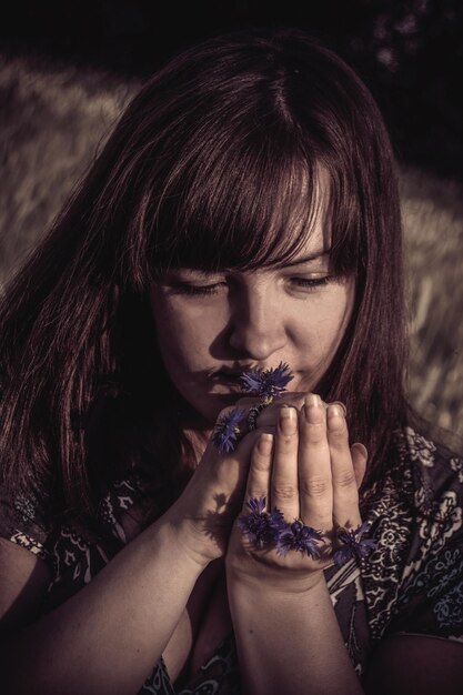 Woman smelling flowers