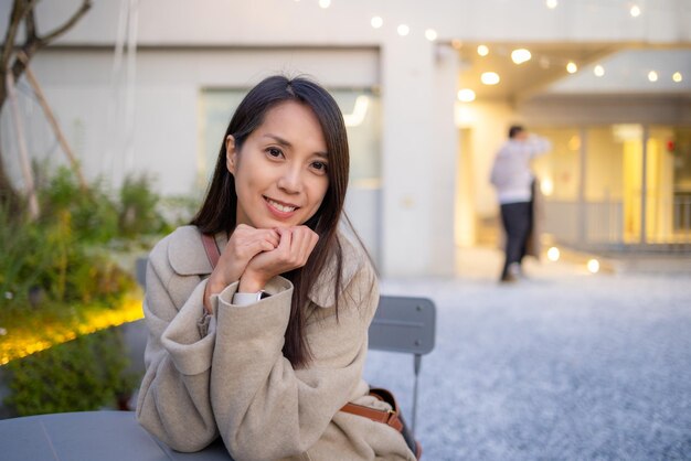 Woman smile to camera in coffee shop