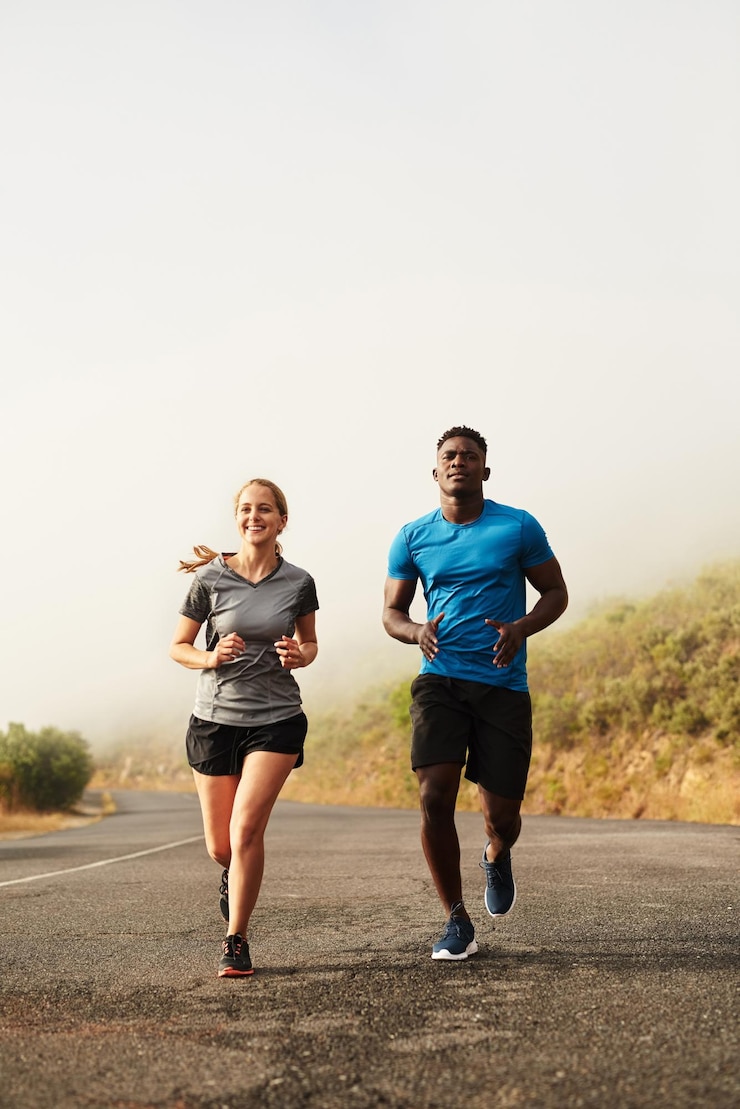 Photo woman smile and coach for running in outdoor for practice marathon race with fitness exercise and cardio training in forest for health athlete people and runner together for challenge workout