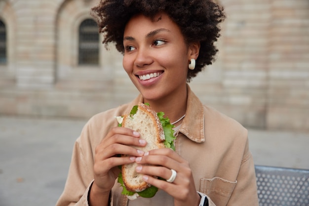 A Young Stylish Girl Smiles Gently and Shows Her Thumb Up, Meaning that Her  Sandwich is Very Tasty, and You Should Try Stock Photo - Image of  lifestyle, american: 118096764