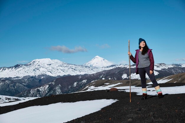 Woman smiles enjoying the scenery of patagonia villarrica national park chile