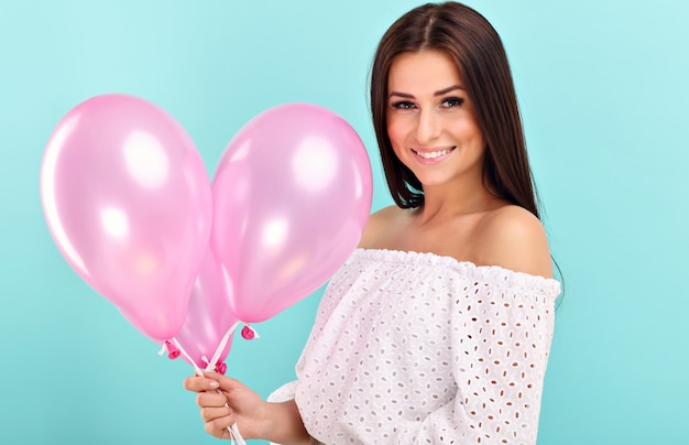 woman smiling against blue background