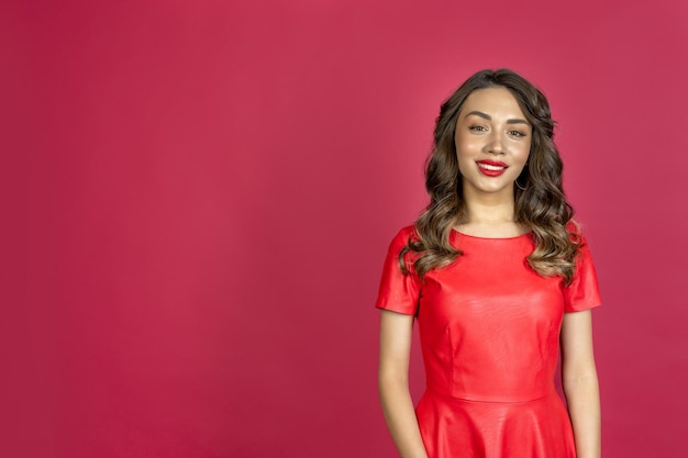 Woman smiling on a red background