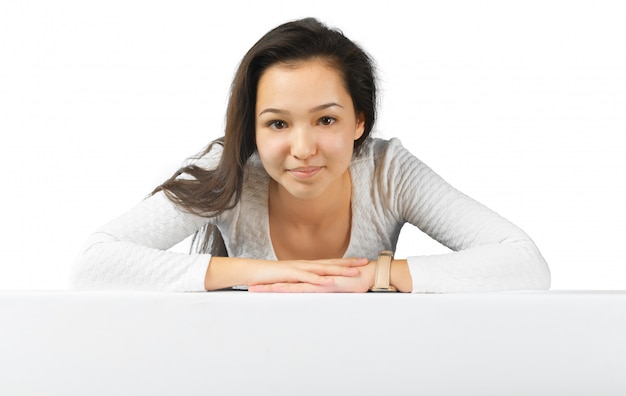 Woman smiling showing white blank sign billboard