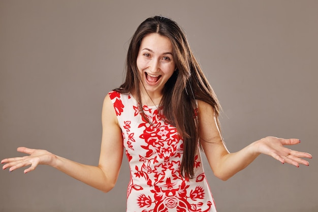 Woman smiling and throws up his hands