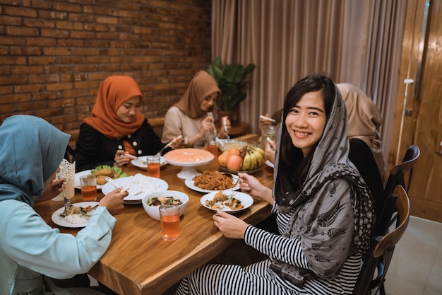 Woman smiling when look at camera in the dining room