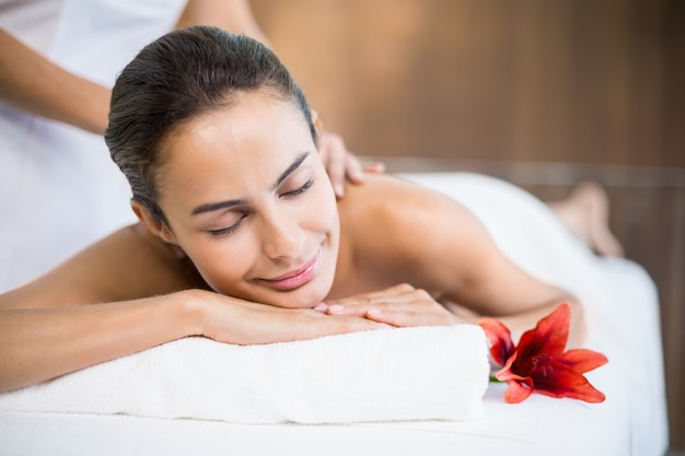 Woman smiling while receiving massage