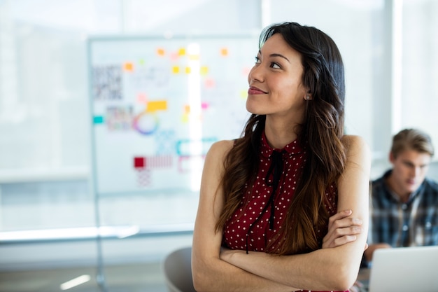 Woman smiling and with looking away in office