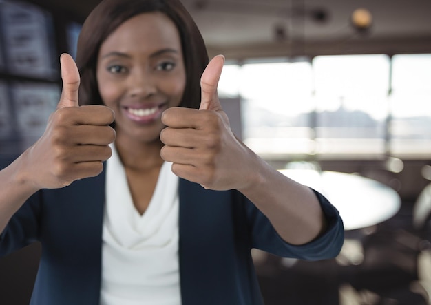 woman smiling with thumbs up