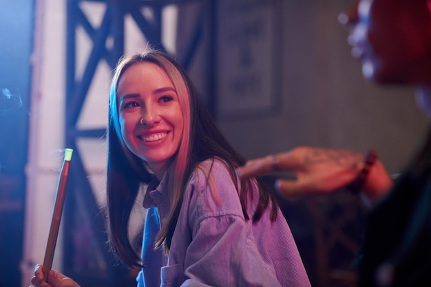 Woman Smoking Hookah with Friends