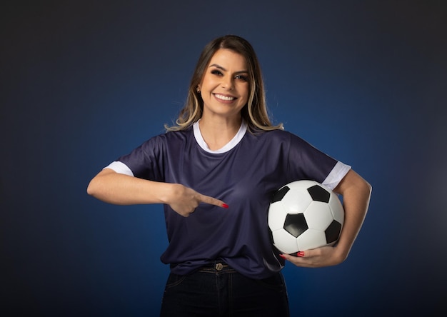 Woman soccer fan cheering for her favorite club and team world cup blue background