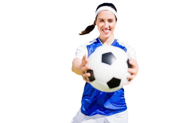 woman soccer player posing with a ball