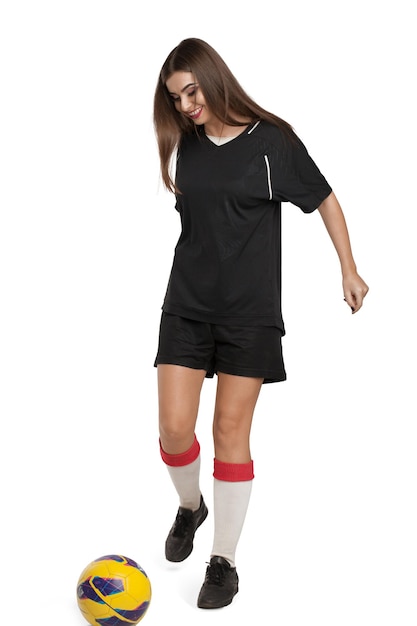 Woman soccer player with soccer ball on white background