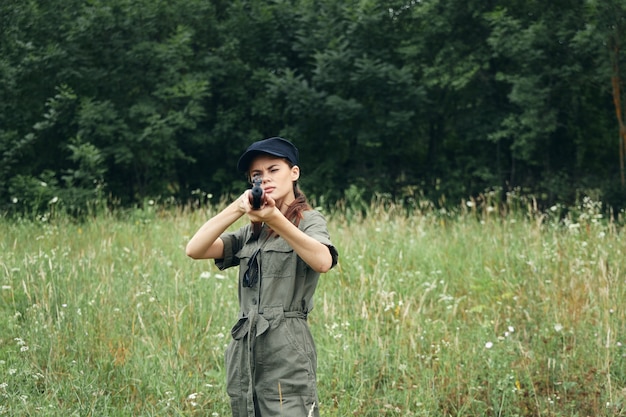 Woman soldier aiming ahead with your weapon hunting is a way of\
life