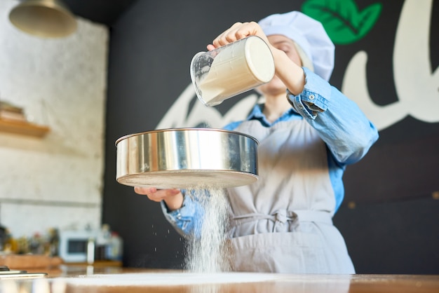 Woman sowing flour