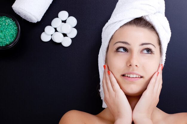 woman in spa salon on black background