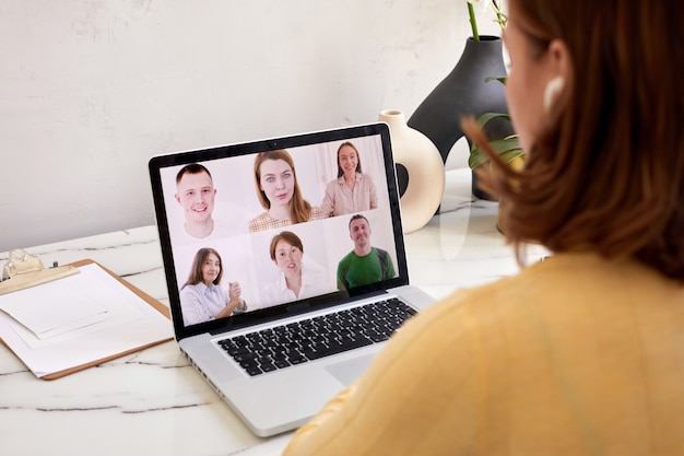 Woman speak using Webcam conference on laptop