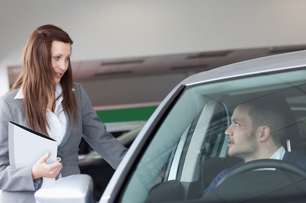 Woman speaking to a man