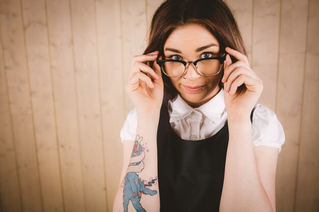 Girl posing near the wall in specs - PixaHive