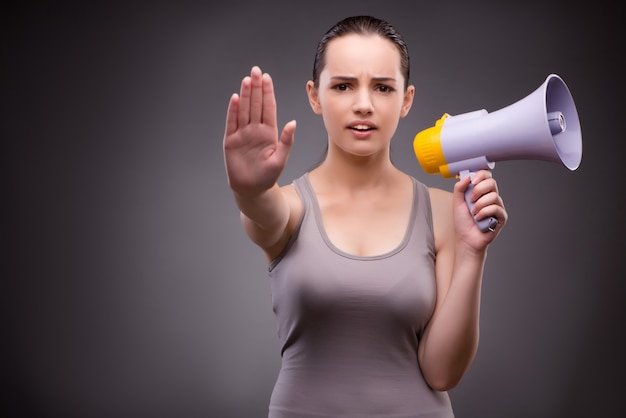 Woman in sports concept with loudspeaker