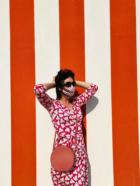 Woman standing against wall