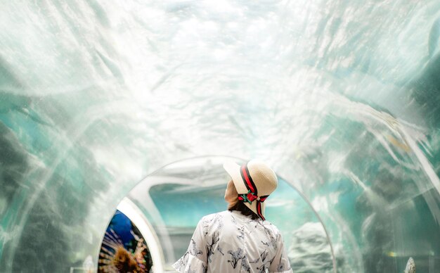 Woman standing in the aquarium