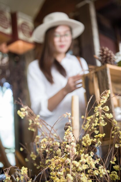 Woman standing by plants