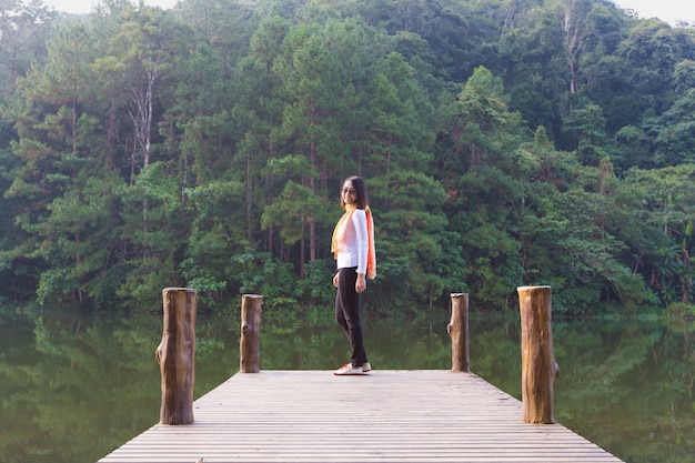 Woman standing at the end of the bridge