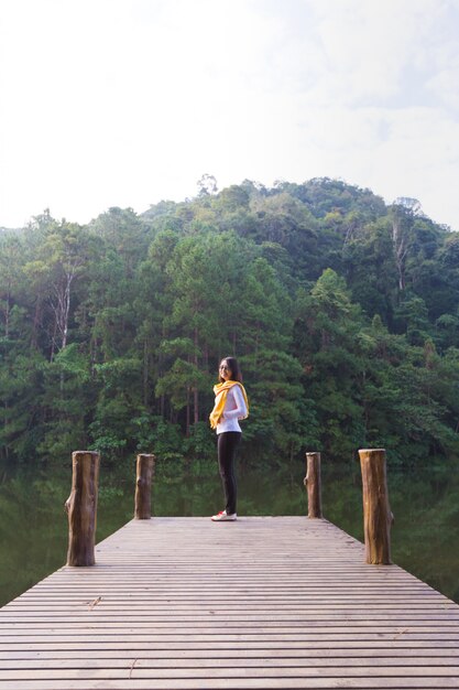 Woman standing at the end of the bridge