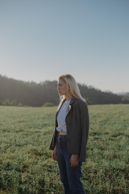 woman standing on field against sky