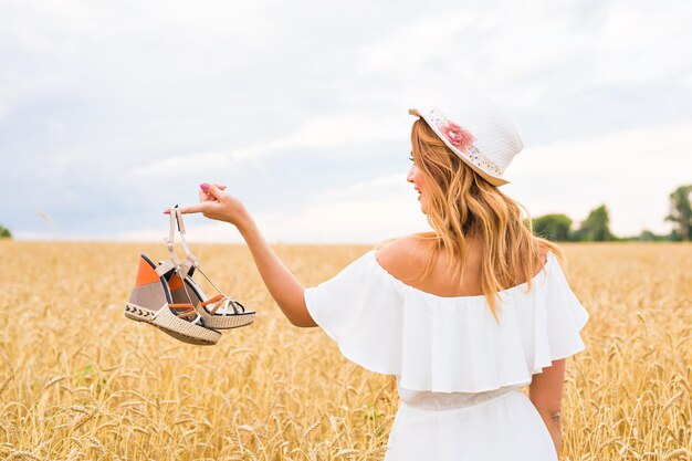 Woman standing on field against sky