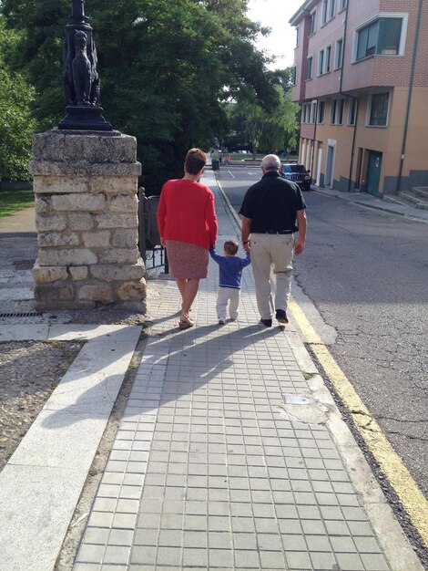 Woman standing on footpath