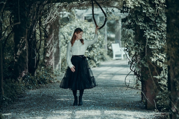 Woman standing in forest