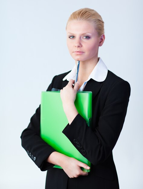 Woman standing holding a folder