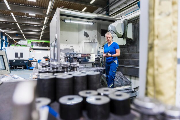 Woman standing in industrial factory