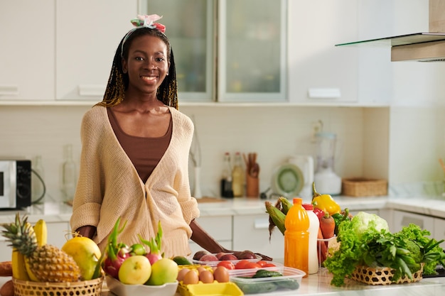 Woman Standing at Kitchen Counter