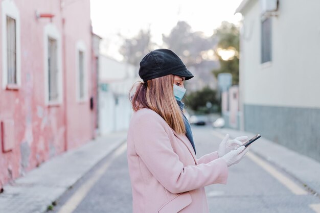 Woman standing on mobile phone