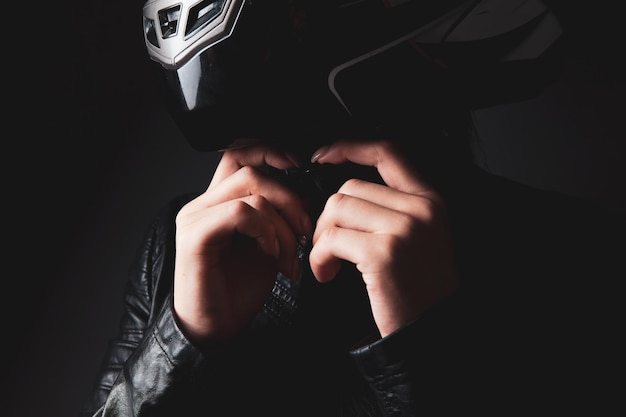 Woman standing in a motorcycle helmet