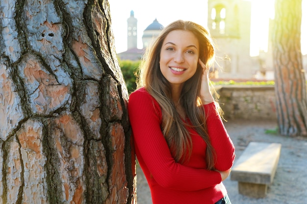 Woman standing near tree