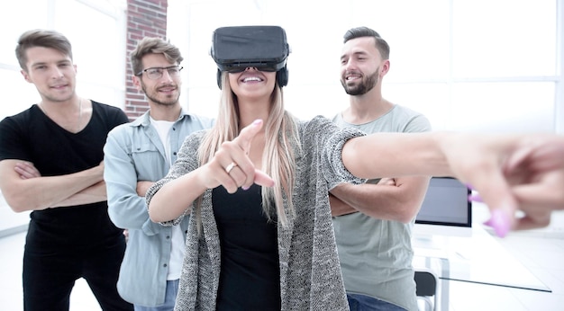 Woman standing in the office with VR glasses