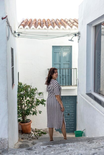 Woman standing outside building