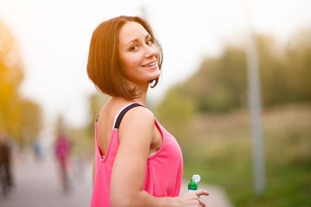 Woman standing and resting after run