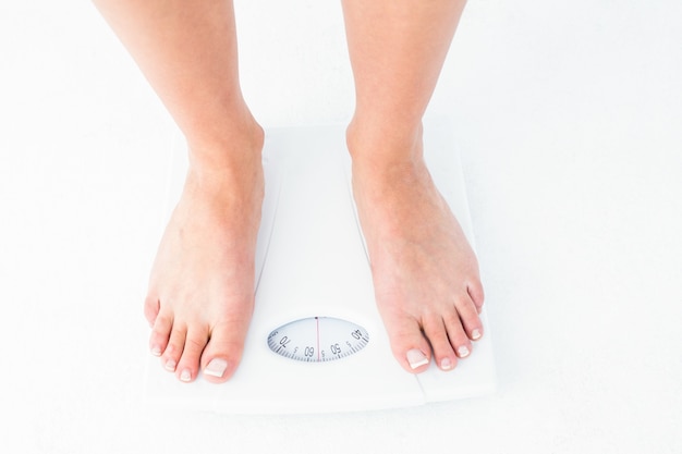 Woman standing on the scales