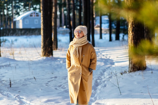 woman standing on snow covered field