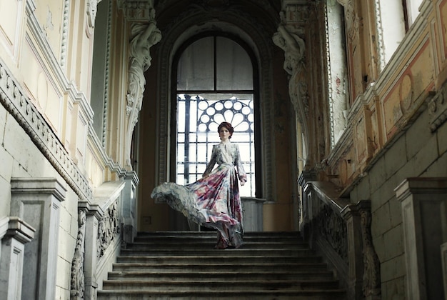 Woman standing on the top of a stairway