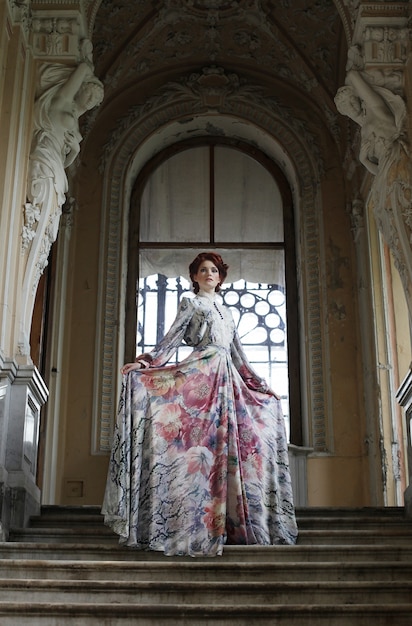 Woman standing on the top of a stairway