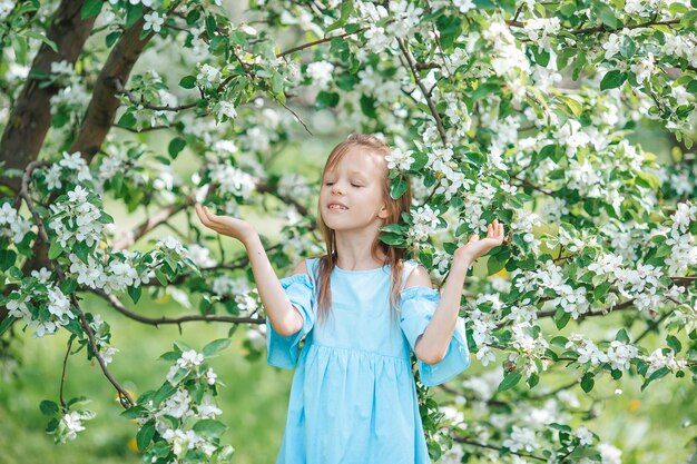 Woman standing on tree against plants